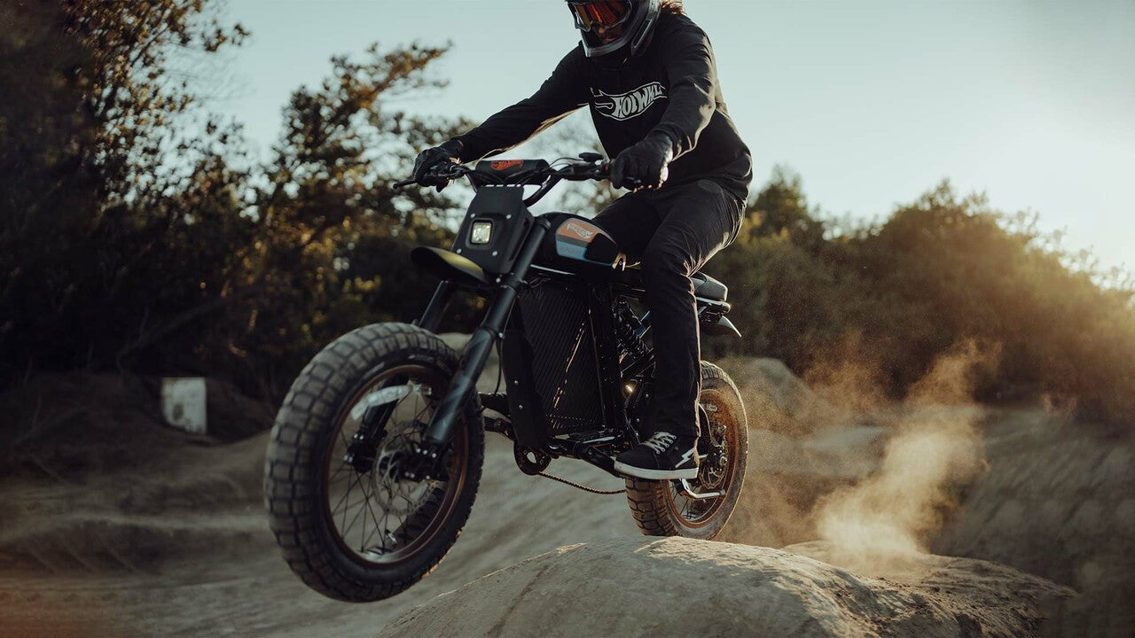 Rider taking on a dirt jump with the Hot Wheels Colab