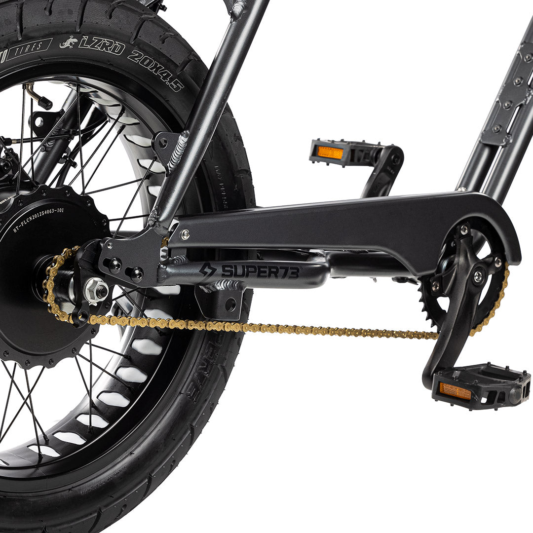 Gold chain on bike with a white background. @color_gold