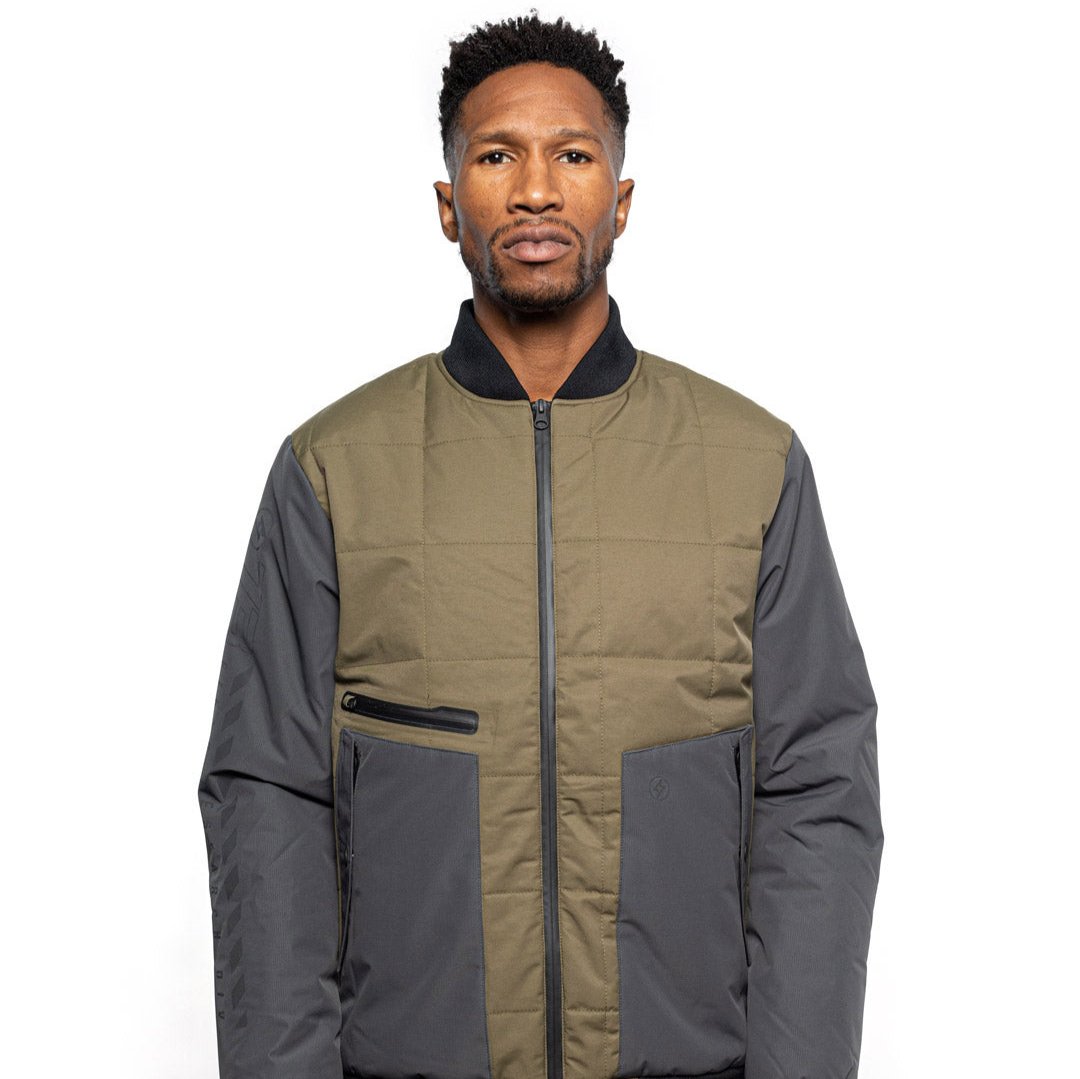 Male model wearing Sipes Varsity Jacket in dark fatigue colorway. @color_dark fatigue