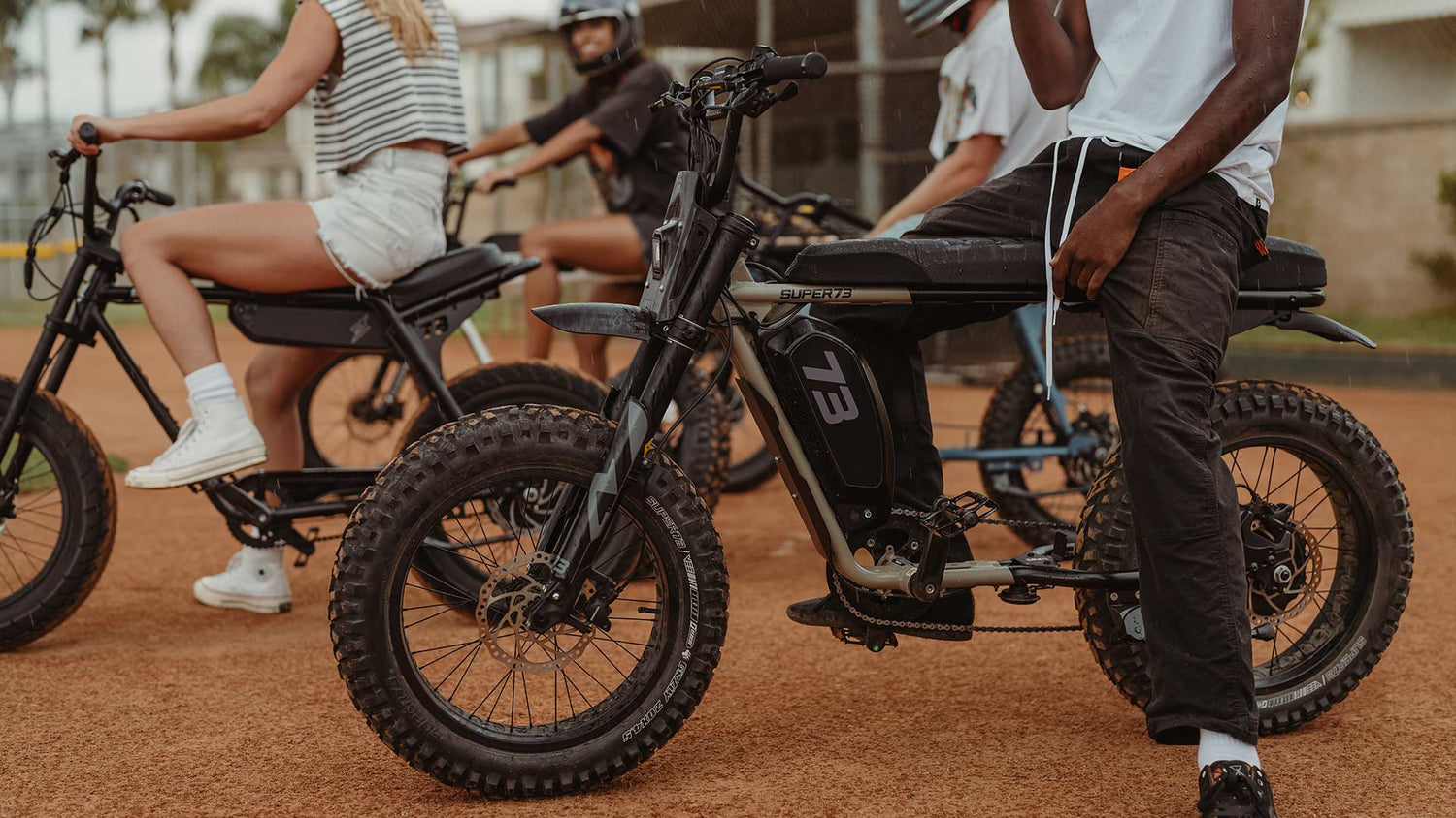 Group of Super73 riders lined up on their bikes at a group ride