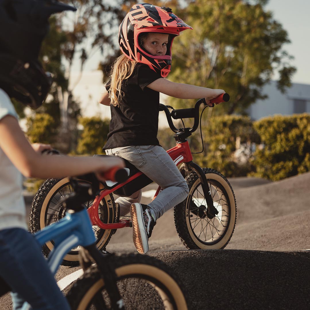 lifestyle image of a kid on a K1D showcasing the K1D Big Trouble Handlebar on K1D