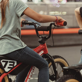 lifestyle image of a kid on a K1D showcasing the K1D Big Trouble Handlebar on K1D