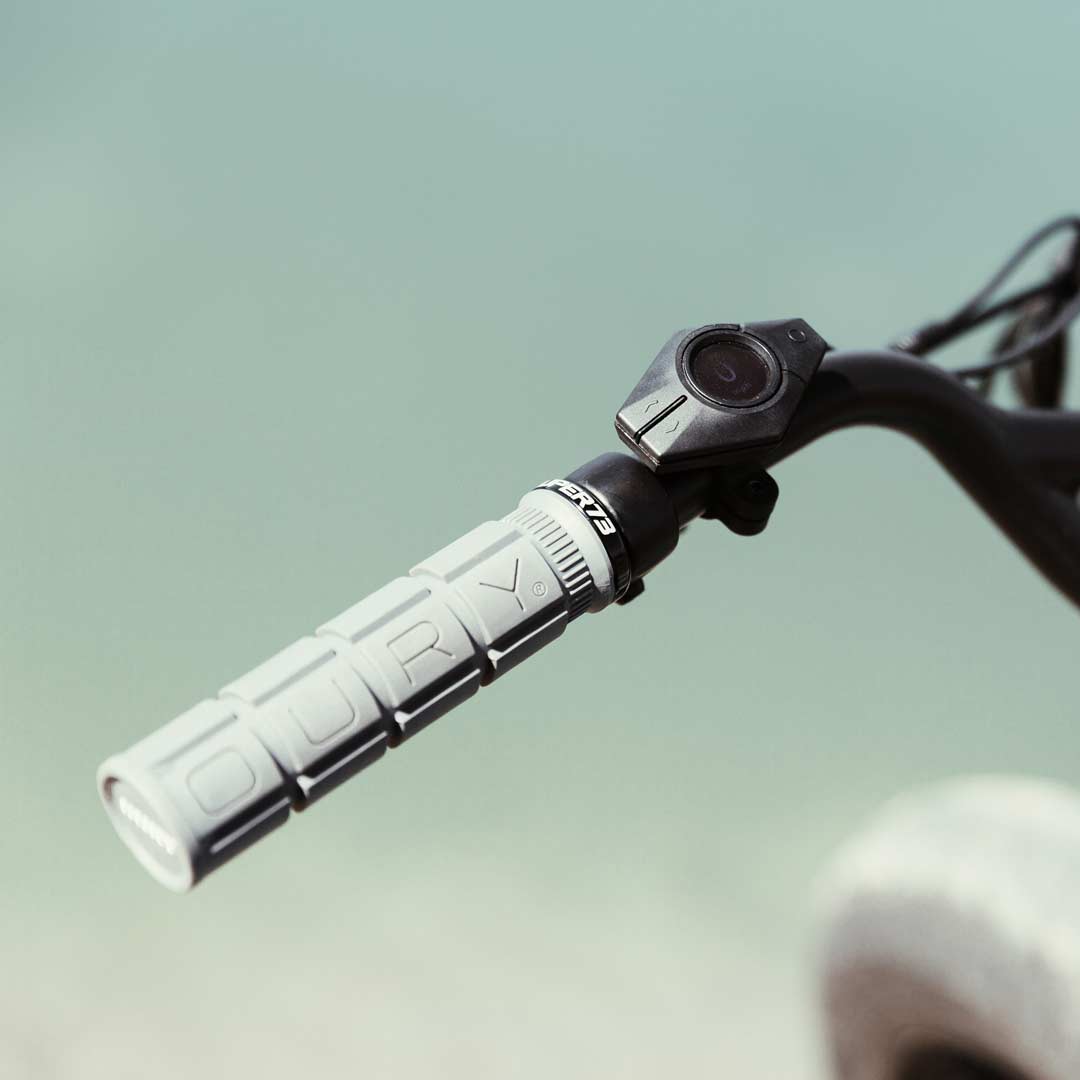 Lifestyle image of the SUPER73 x Oury Single-Sided Locked-On V2 grips in graphite. @color_graphite