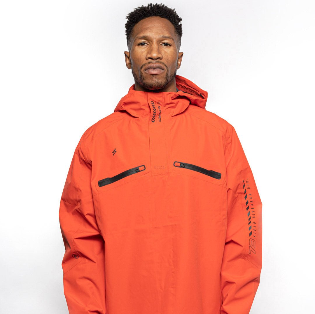 Male model wearing Vale Packable Anorak in blood orange colorway. @color_blood orange
