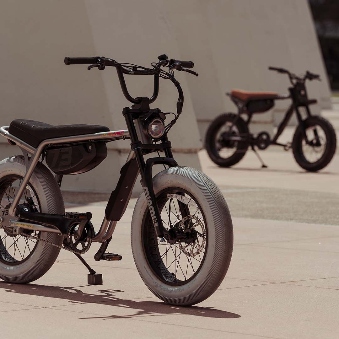 Lifestyle image with a SUPER73-Z Miami LE in the foreground and a SUPER73-ZX SE in the background